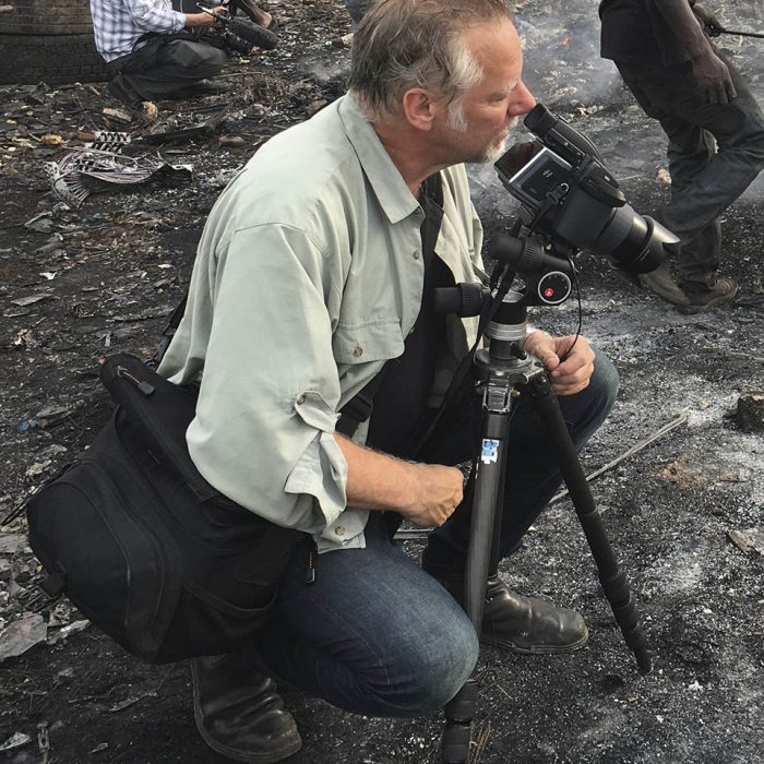 Burtynsky with Jim Panou in Agbogbloshie Recycling Yard, Accra, Ghana, 2017_Photograph by Nathan Otoo, courtesy of the Studio of Edward Burtynsky